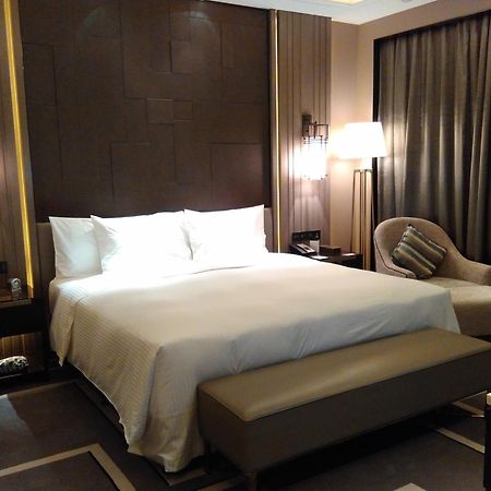 Wanda Realm Hotel Dongying Rum bild
