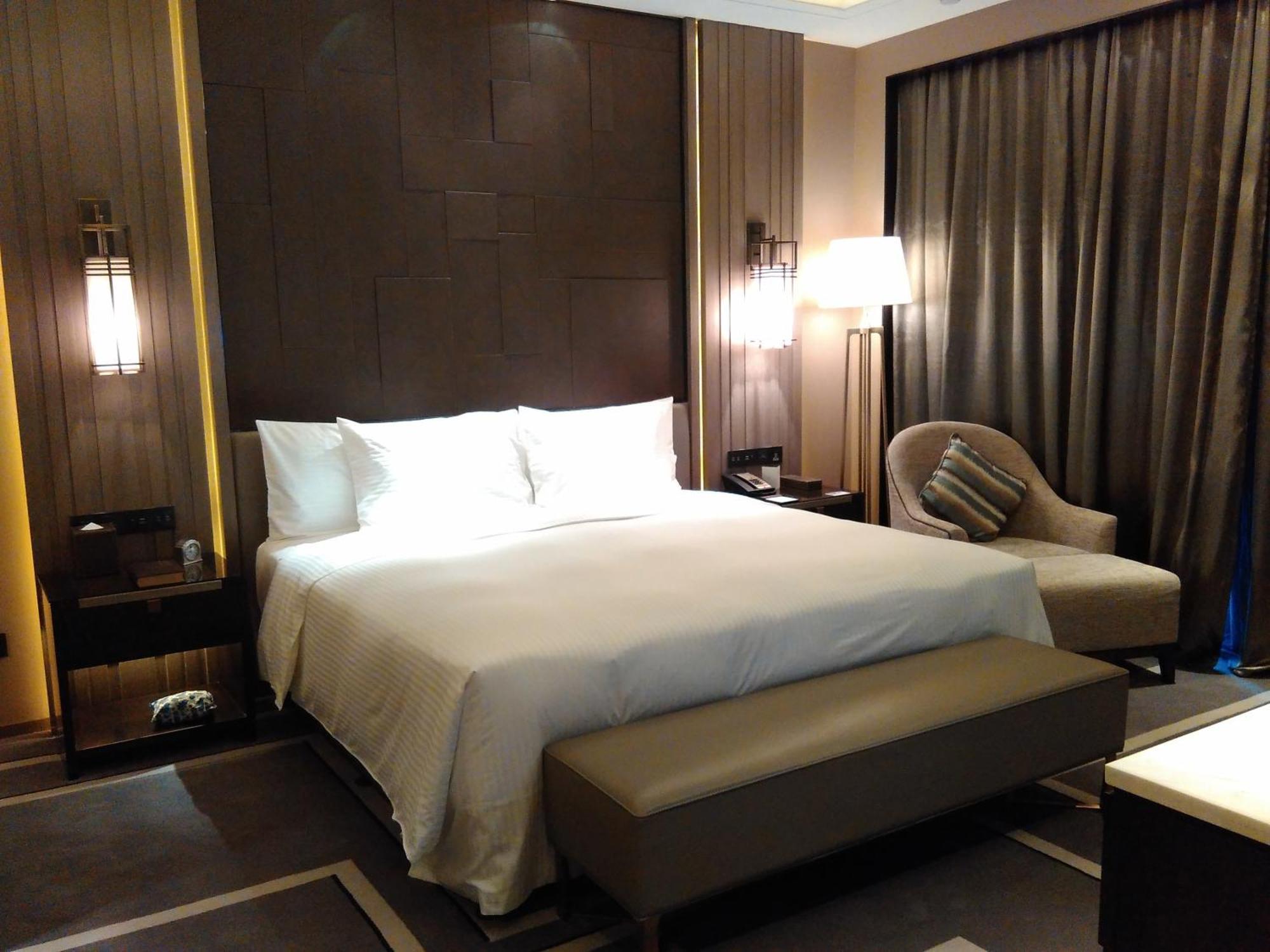 Wanda Realm Hotel Dongying Rum bild